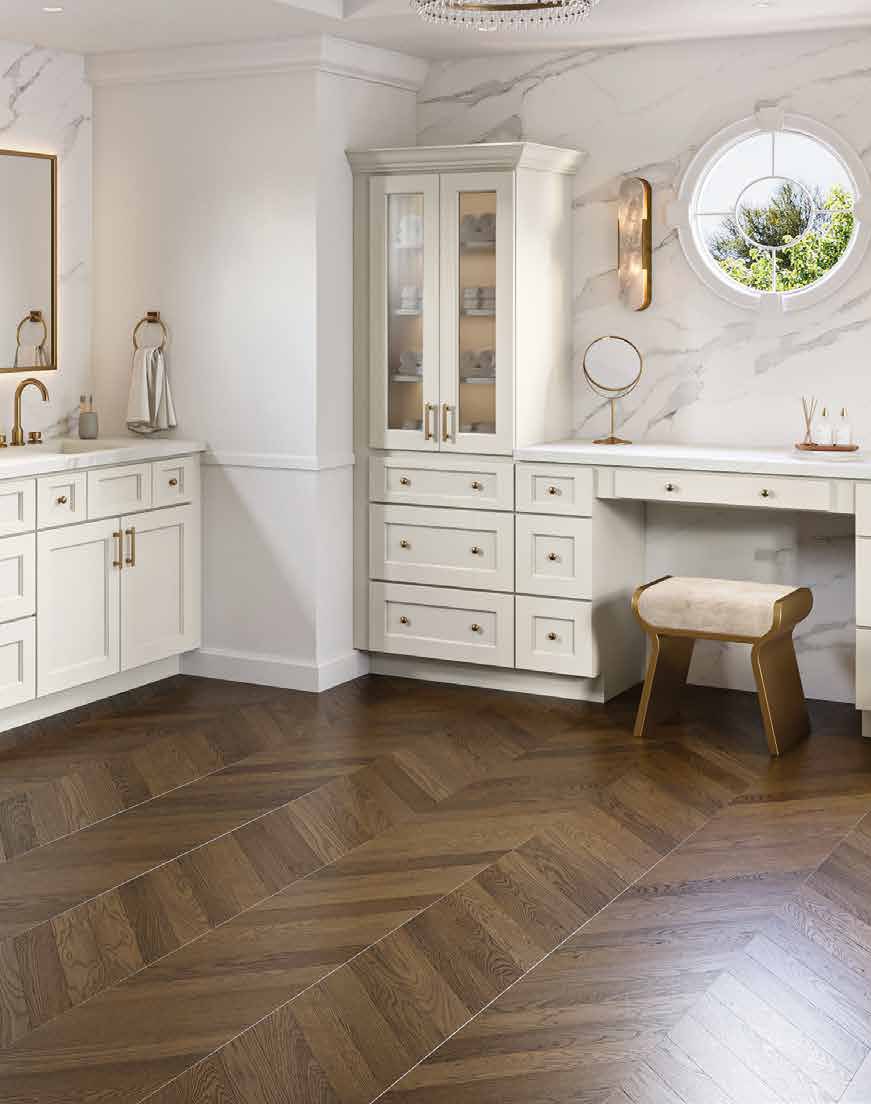 Cream painted bathroom vanity cabinets with glass-front tower and marble surround